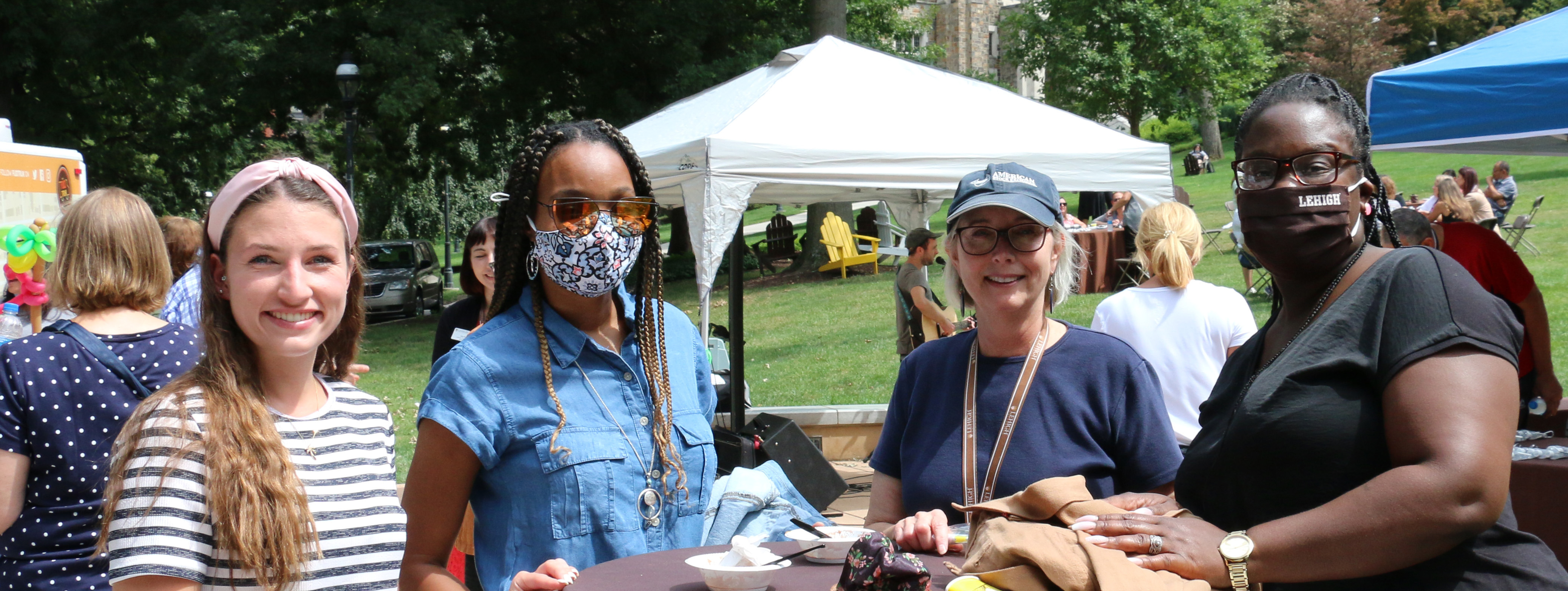 Four Lehigh employees enjoying the welcome back social event in August 2021.