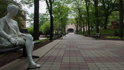 A view of Memorial Walkway featuring a George Segal sculpture