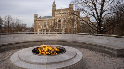 A view of the Clayton University Center firepit overlooking Linderman Library